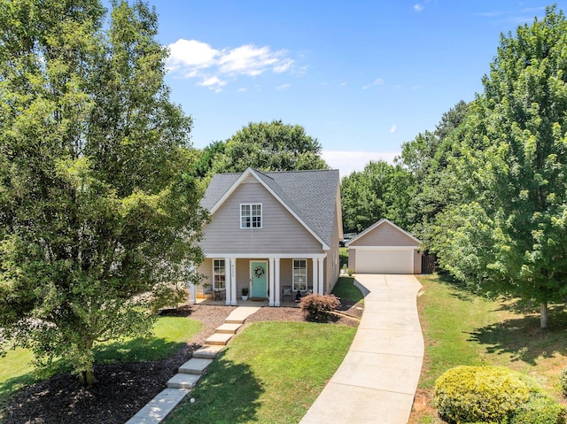 8225 Ballymore Ct, Huntersville, NC 28078 - traditional home with a garage, covered porch, a front lawn, an outdoor structure, and a shingled roof