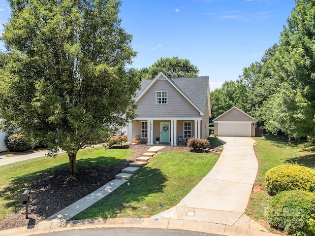 8225 Ballymore Ct, Huntersville, NC 28078 - bungalow-style home with a front yard, a detached garage, covered porch, and an outbuilding