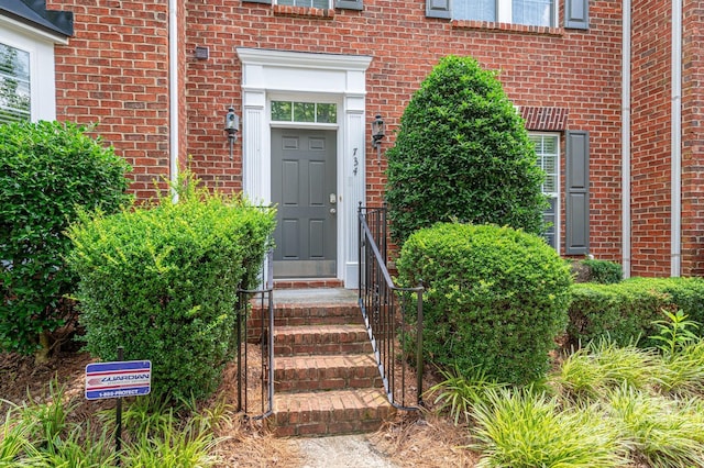 734 Naramore St, Davidson, NC 28036 - view of exterior entry featuring brick siding