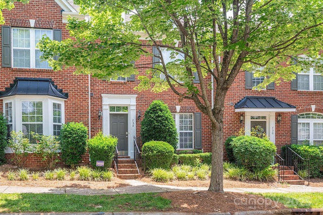 734 Naramore St, Davidson, NC 28036 - view of front of property featuring brick siding and a standing seam roof