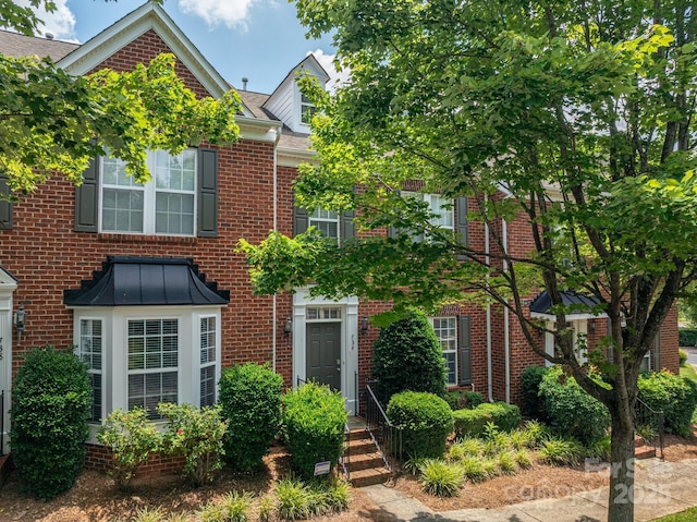734 Naramore St, Davidson, NC 28036 - view of front of house featuring brick siding