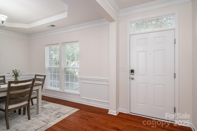 734 Naramore St, Davidson, NC 28036 - entryway featuring wood finished floors, crown molding, and a tray ceiling