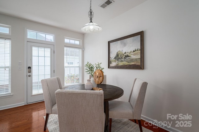 734 Naramore St, Davidson, NC 28036 - dining space with dark wood-style flooring and baseboards