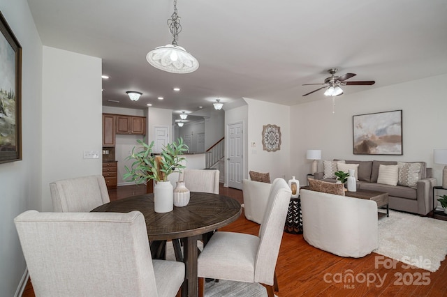 734 Naramore St, Davidson, NC 28036 - dining room with stairway, wood finished floors, a ceiling fan, and recessed lighting