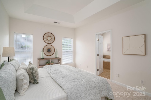 734 Naramore St, Davidson, NC 28036 - carpeted bedroom featuring multiple windows and a raised ceiling