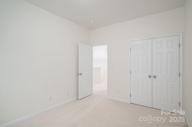 734 Naramore St, Davidson, NC 28036 - unfurnished bedroom featuring light carpet and a closet