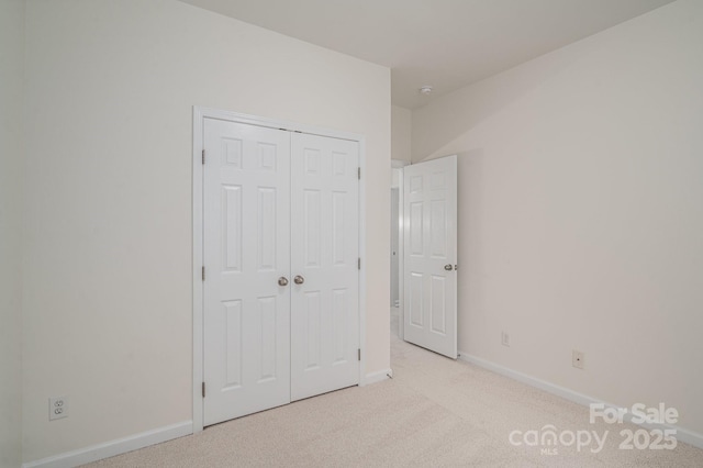 734 Naramore St, Davidson, NC 28036 - unfurnished bedroom featuring carpet and a closet