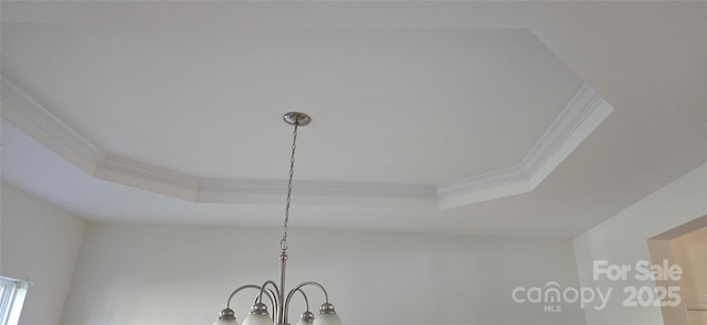 162 Autumn Falls Dr, Lake Wylie, SC 29710 - detailed view of crown molding, a tray ceiling, and a chandelier