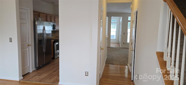 162 Autumn Falls Dr, Lake Wylie, SC 29710 - corridor featuring light wood finished floors and stairway