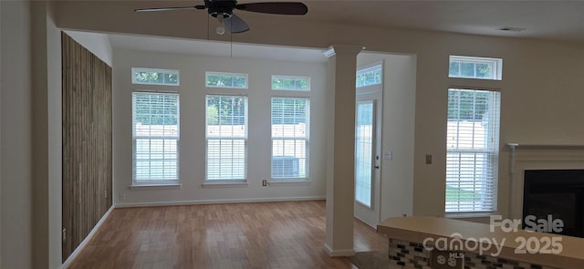 162 Autumn Falls Dr, Lake Wylie, SC 29710 - entryway featuring a ceiling fan, decorative columns, wood finished floors, and a fireplace