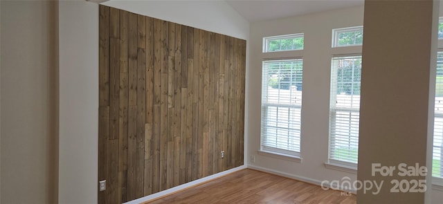 162 Autumn Falls Dr, Lake Wylie, SC 29710 - unfurnished room featuring wood finished floors and vaulted ceiling
