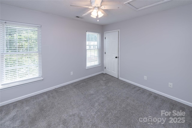 2085 Chapel Creek Rd SW, Concord, NC 28025 - spare room with carpet flooring, healthy amount of natural light, attic access, and a ceiling fan
