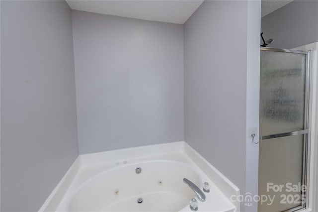2085 Chapel Creek Rd SW, Concord, NC 28025 - bathroom with a stall shower and a tub with jets
