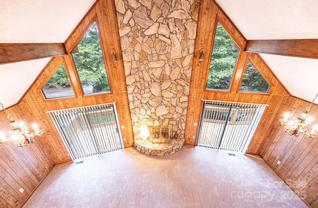 366 Charlois St, Hudson, NC 28638 - unfurnished living room featuring wooden walls, a chandelier, and carpet flooring