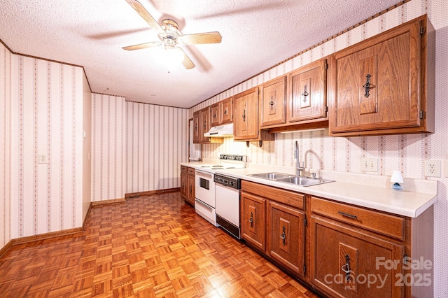 366 Charlois St, Hudson, NC 28638 - kitchen with under cabinet range hood, wallpapered walls, white appliances, a ceiling fan, and a textured ceiling