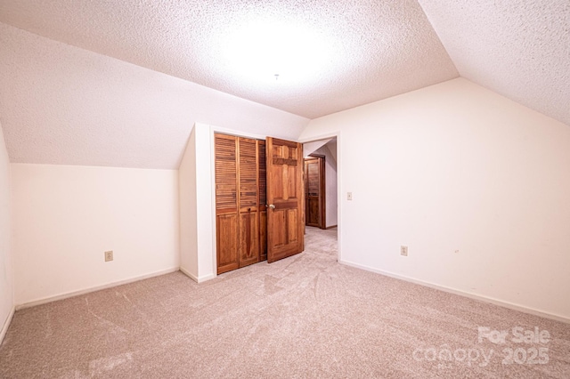 366 Charlois St, Hudson, NC 28638 - additional living space featuring lofted ceiling, light carpet, and a textured ceiling