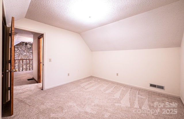366 Charlois St, Hudson, NC 28638 - additional living space featuring carpet floors, lofted ceiling, and a textured ceiling