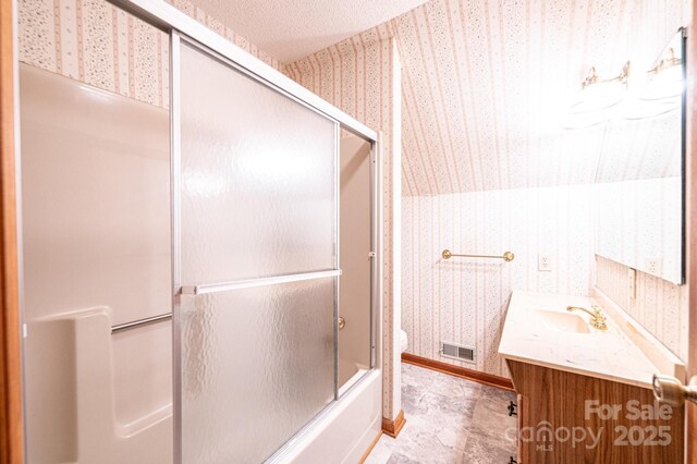 366 Charlois St, Hudson, NC 28638 - bathroom with wallpapered walls, vanity, and bath / shower combo with glass door