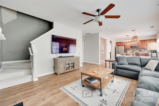 2103 Cantata Ct, Matthews, NC 28105 - living area featuring ceiling fan and light wood finished floors
