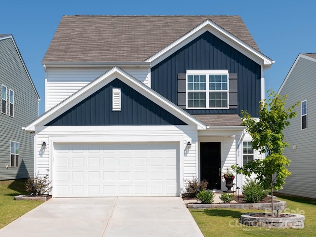 2796 Legacy Ridge Ln, Catawba, NC 28609 - traditional-style house with driveway, a shingled roof, board and batten siding, and a garage
