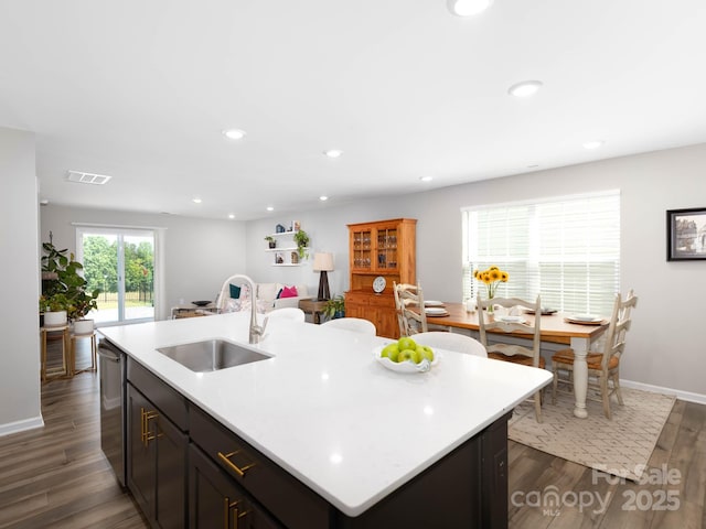 2796 Legacy Ridge Ln, Catawba, NC 28609 - kitchen featuring light countertops, dark wood-style floors, a center island with sink, stainless steel dishwasher, and recessed lighting