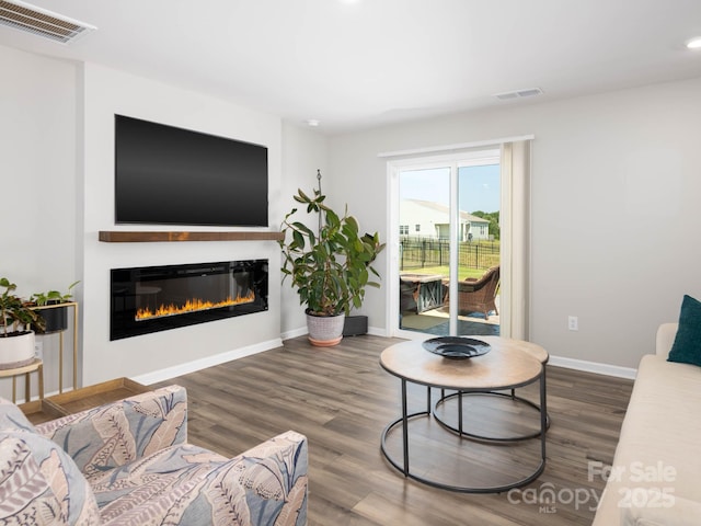 2796 Legacy Ridge Ln, Catawba, NC 28609 - living room featuring a glass covered fireplace, wood finished floors, and recessed lighting