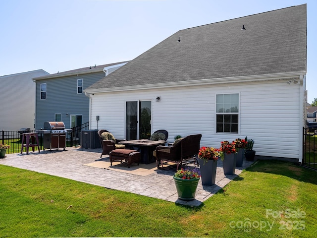 2796 Legacy Ridge Ln, Catawba, NC 28609 - back of house with a patio area, roof with shingles, and an outdoor fire pit