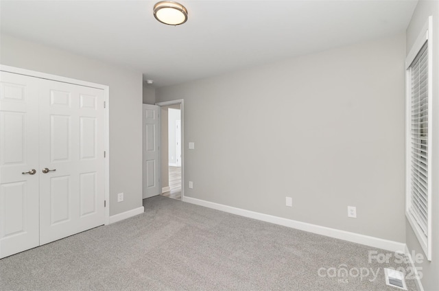 608 Red Hawk Way, Clover, SC 29710 - unfurnished bedroom with carpet and a closet
