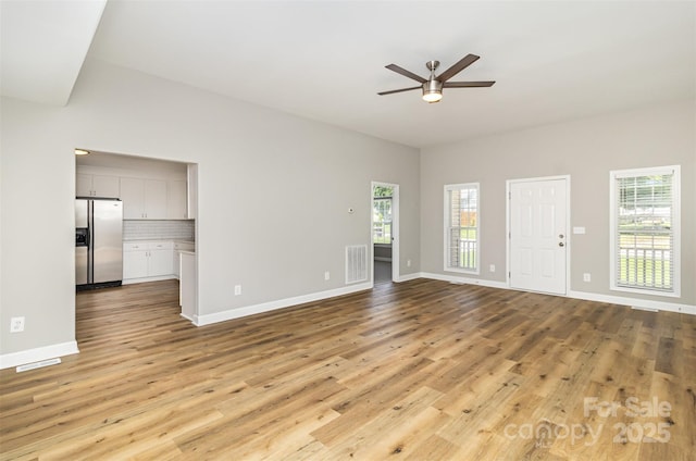 608 Red Hawk Way, Clover, SC 29710 - unfurnished living room featuring ceiling fan, plenty of natural light, and light wood finished floors