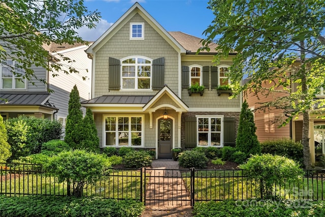 115 Boyce Rd, Charlotte, NC 28211 - view of front of home with a standing seam roof, a fenced front yard, a metal roof, and a shingled roof