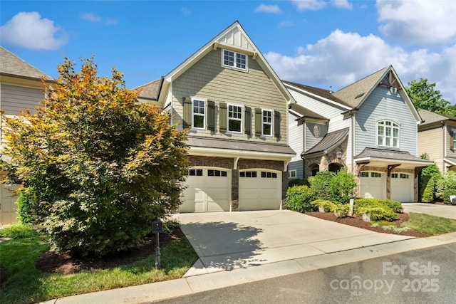 115 Boyce Rd, Charlotte, NC 28211 - view of front of house with an attached garage, stone siding, and driveway