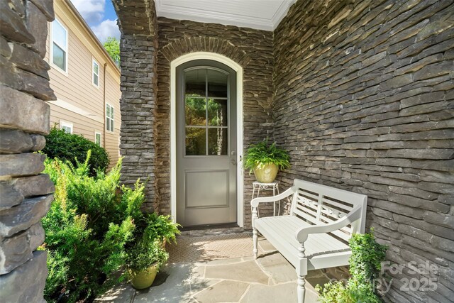 115 Boyce Rd, Charlotte, NC 28211 - view of exterior entry featuring stone siding
