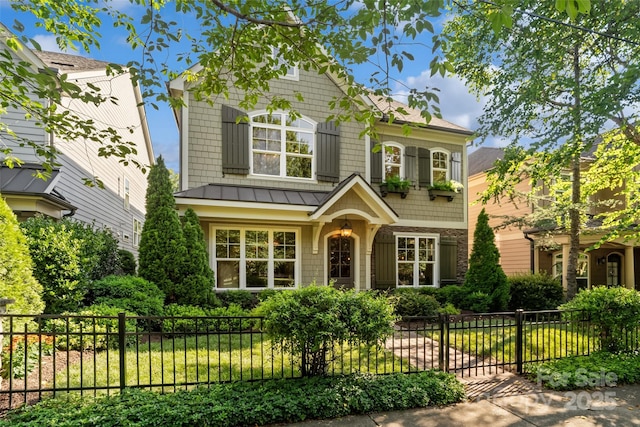 115 Boyce Rd, Charlotte, NC 28211 - view of front of home with a standing seam roof, a fenced front yard, and a metal roof