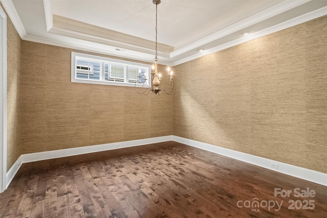 115 Boyce Rd, Charlotte, NC 28211 - unfurnished dining area featuring a raised ceiling, dark wood-style floors, ornamental molding, a chandelier, and wallpapered walls