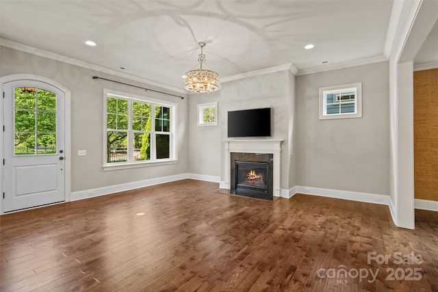 115 Boyce Rd, Charlotte, NC 28211 - unfurnished living room featuring crown molding, dark wood-style flooring, a chandelier, a high end fireplace, and recessed lighting