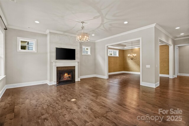 115 Boyce Rd, Charlotte, NC 28211 - unfurnished living room featuring a chandelier, a premium fireplace, dark wood-type flooring, recessed lighting, and crown molding