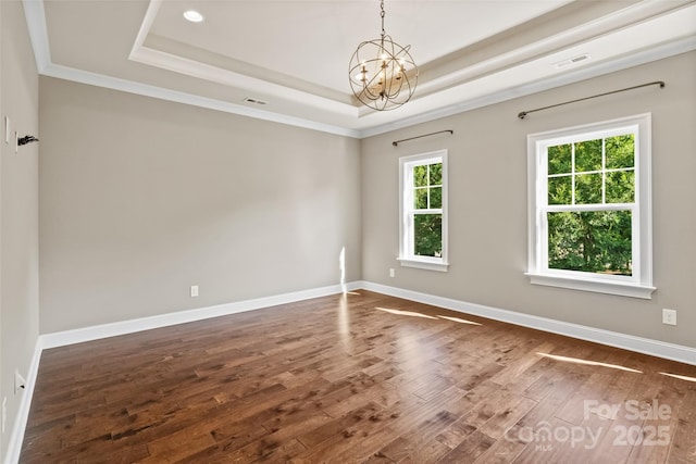 115 Boyce Rd, Charlotte, NC 28211 - unfurnished room featuring a tray ceiling, a chandelier, dark wood finished floors, and crown molding