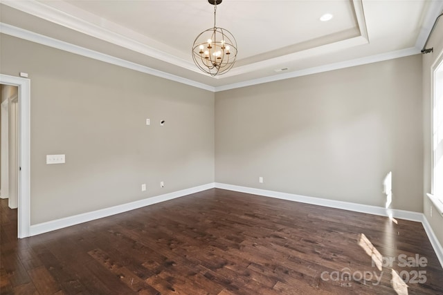115 Boyce Rd, Charlotte, NC 28211 - unfurnished room featuring a tray ceiling, a chandelier, dark wood-type flooring, and crown molding