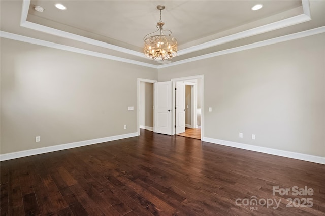 115 Boyce Rd, Charlotte, NC 28211 - spare room with a raised ceiling, a chandelier, wood finished floors, crown molding, and recessed lighting