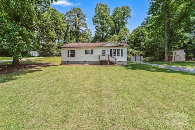 1631 Berkley St SW, Lenoir, NC 28645 - view of front of home featuring a shed, crawl space, and a front yard