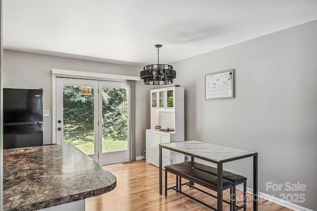 1631 Berkley St SW, Lenoir, NC 28645 - dining space with a chandelier and light wood finished floors