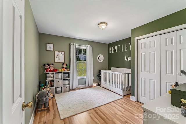 1631 Berkley St SW, Lenoir, NC 28645 - bedroom with wood finished floors, a closet, and a crib
