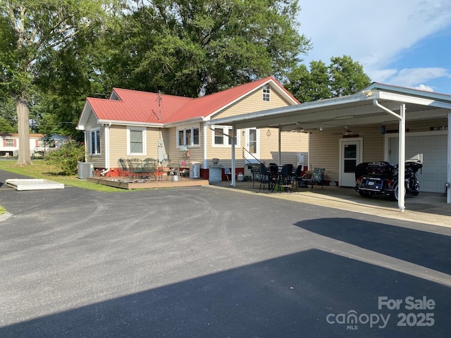 4303 Grier St, Gastonia, NC 28056 - view of building exterior with an attached carport, entry steps, and driveway
