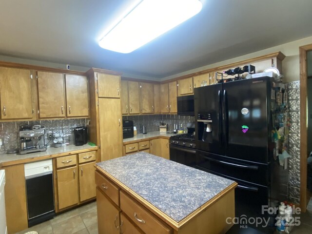 4303 Grier St, Gastonia, NC 28056 - kitchen with black appliances, decorative backsplash, brown cabinetry, and a center island