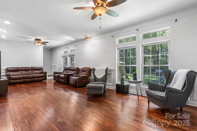 7648 Forest Oak Dr, Denver, NC 28037 - living area featuring ceiling fan, ornamental molding, plenty of natural light, and hardwood / wood-style flooring