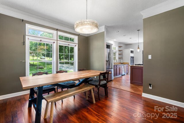 7648 Forest Oak Dr, Denver, NC 28037 - dining area featuring ornamental molding, a chandelier, and dark wood-style floors