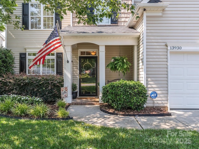 13930 Daltrey Ln, Charlotte, NC 28277 - doorway to property with an attached garage