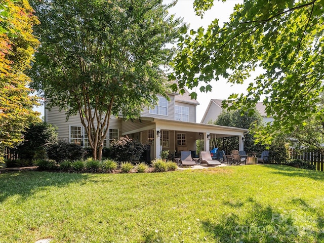 13930 Daltrey Ln, Charlotte, NC 28277 - rear view of house featuring a patio area and a lawn