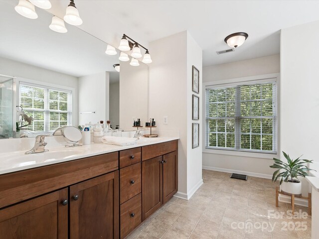 13930 Daltrey Ln, Charlotte, NC 28277 - bathroom with double vanity and tile patterned floors