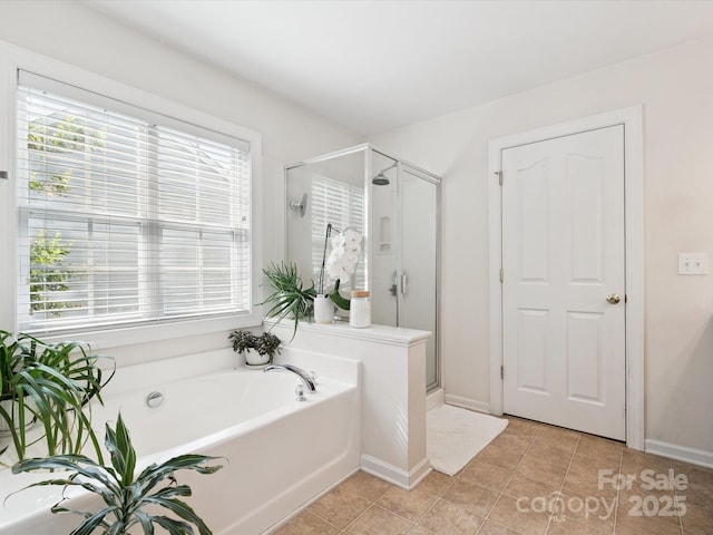 13930 Daltrey Ln, Charlotte, NC 28277 - bathroom featuring a stall shower, a bath, and tile patterned floors